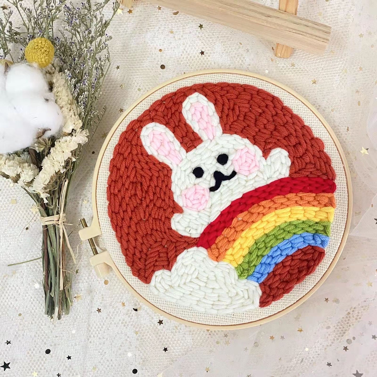 Rainbow Bunny Punch Needle Kit - white bunny and colorful rainbow design on a dark red background