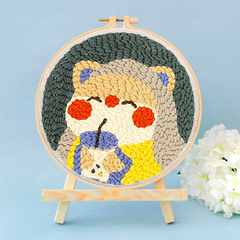 Bear Drinking Boba Punch Needle Kit - cartoon bear drinking bubble tea design on a dark green background