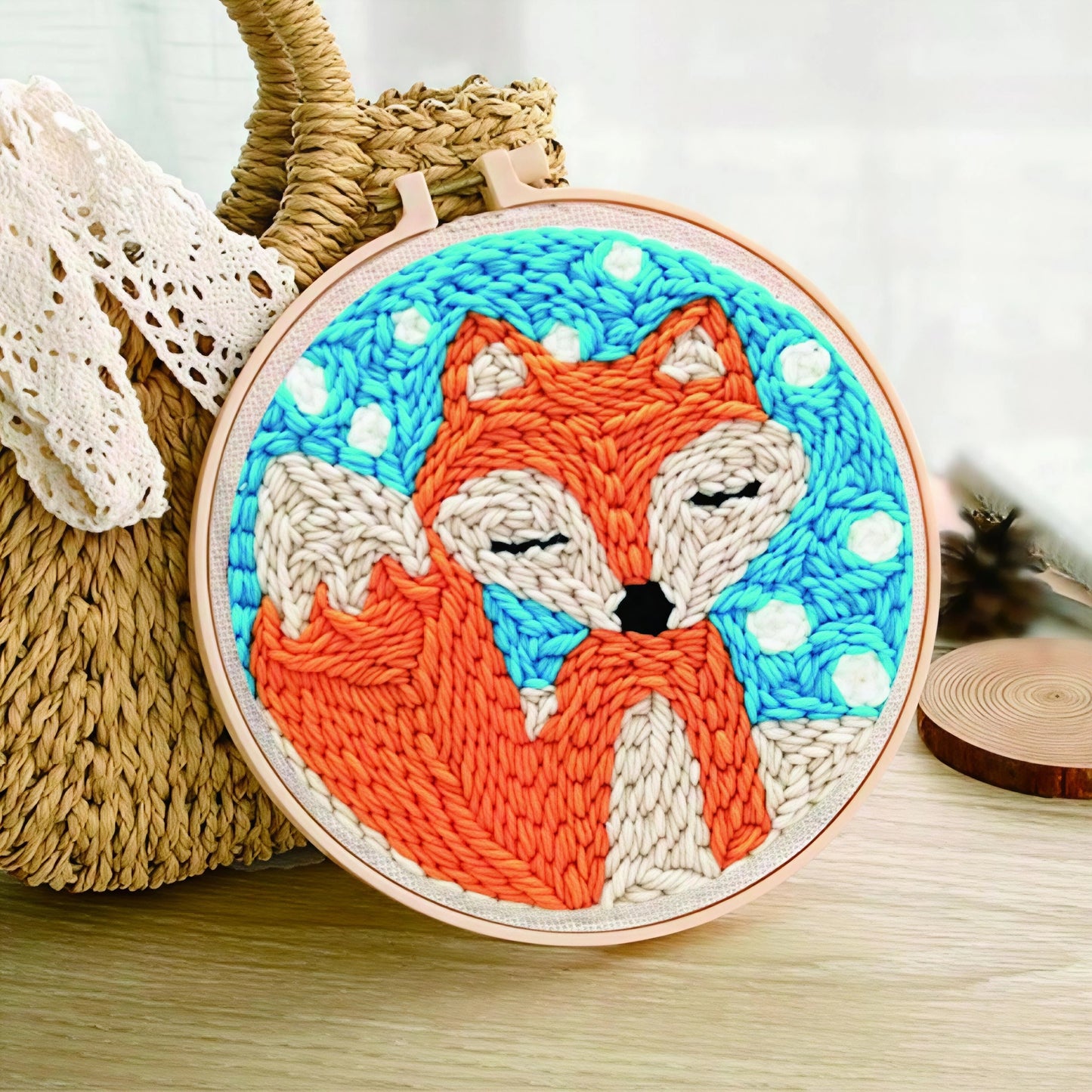Snowy Fox Nap Punch Needle Kit - orange and cream sleeping fox design with white snow on a vibrant blue background