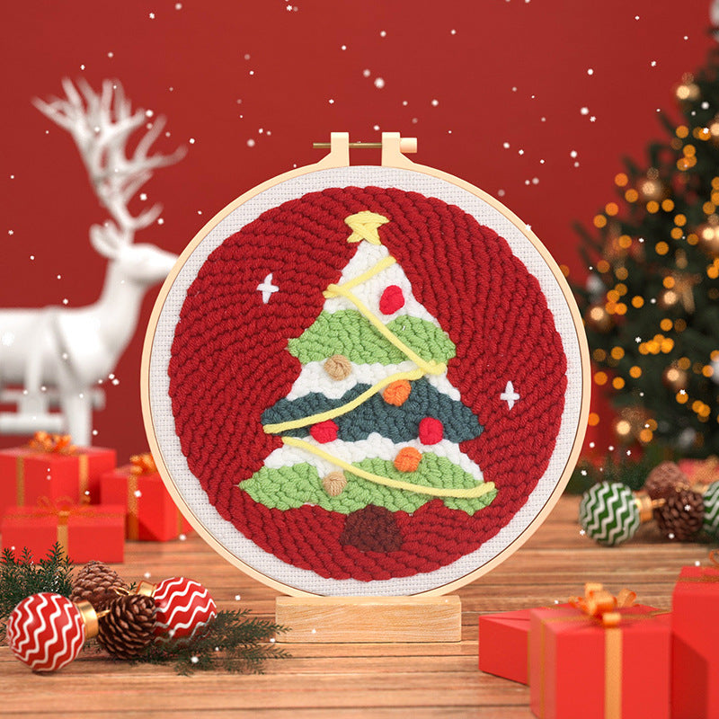 Starlit Christmas Tree Punch Needle Kit - red background with green, white, and gold festive holiday design